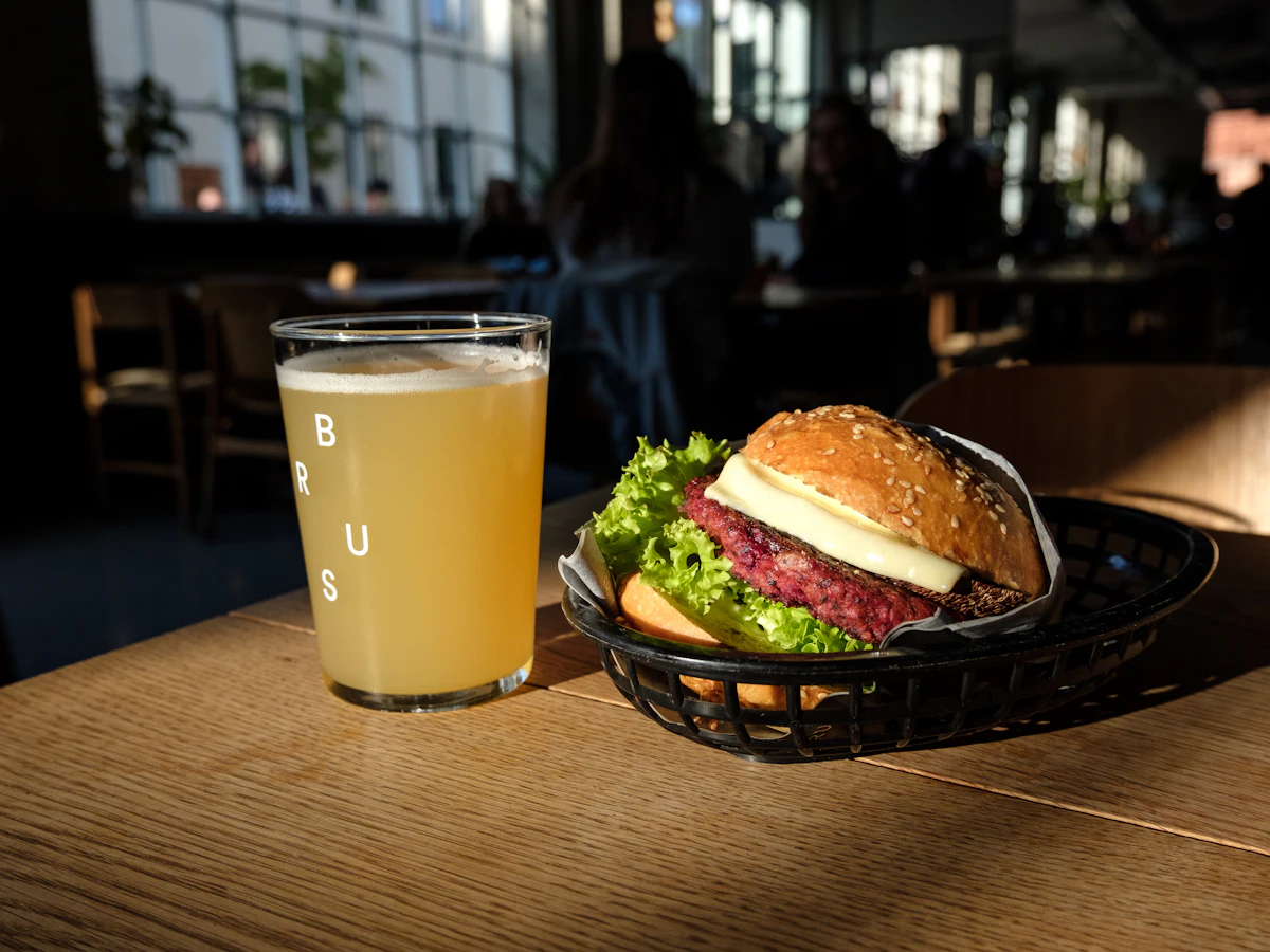 Craft burger with beer served on a rustic table