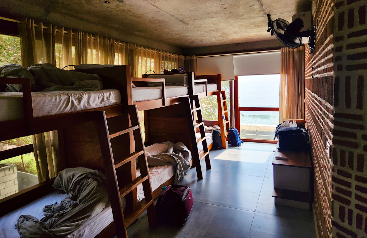 Shared dorm with bunk beds and natural light